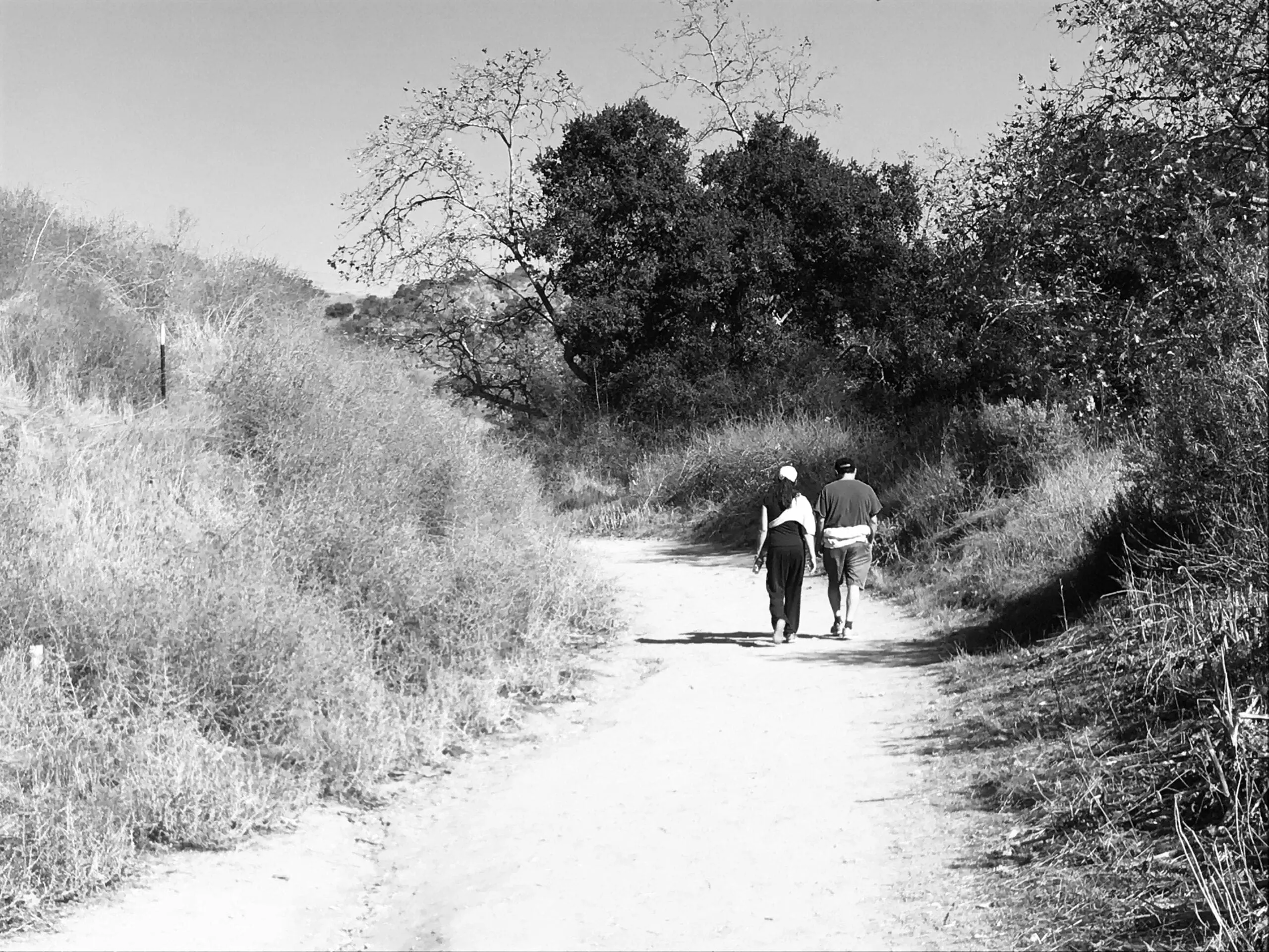 Turnbull Canyon Trail black and white photo of couple walking trail