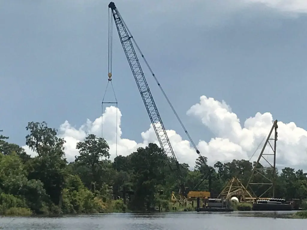 crane working by swamp