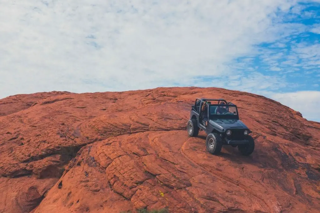 Jeep driving over rocks