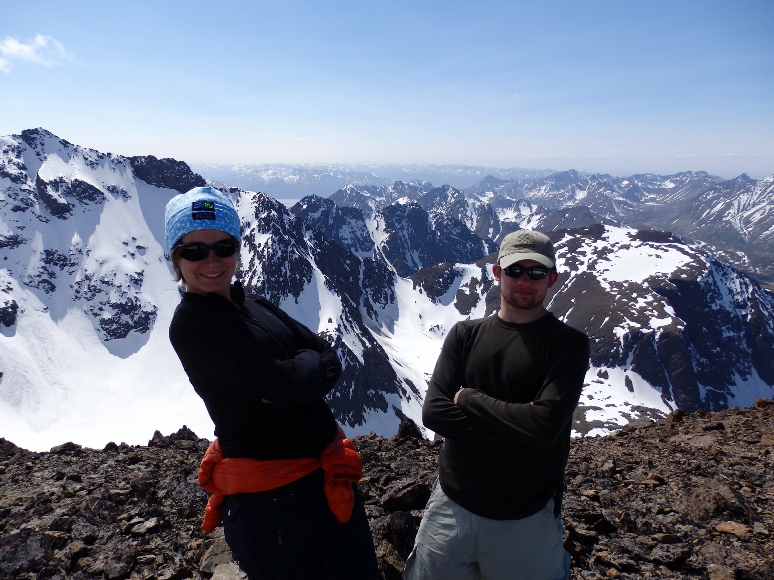 Cantata Peak summit with mountains in background.